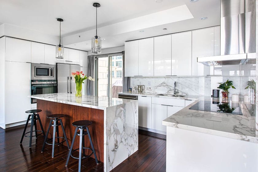 Clean-white-kitchen-Las-Vegas-26 modern white kitchen with waterfall edge island in a Las Vegas home for sale