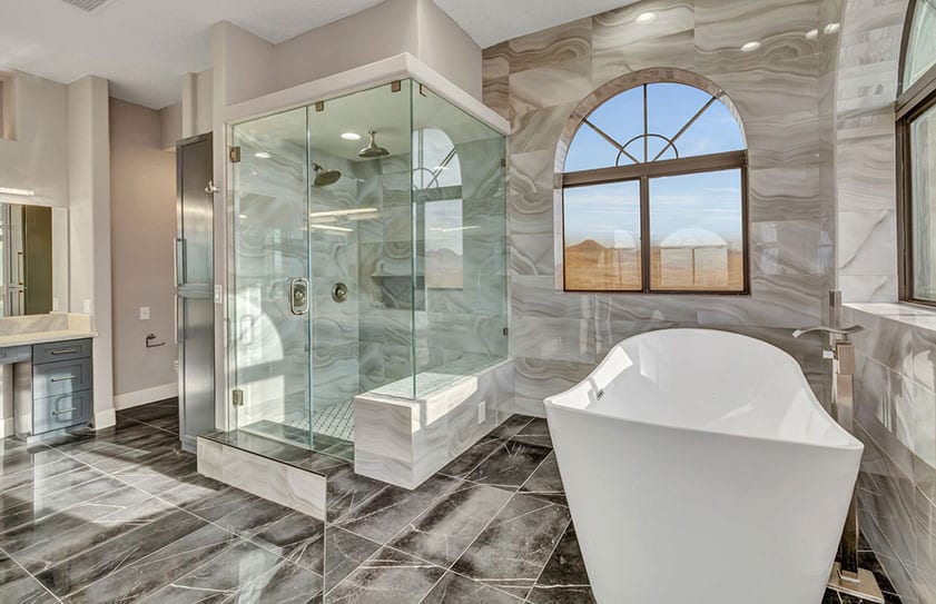 Luxury-Bathroom-Las-Vegas Beautiful modern bathroom with large tub, glass shower, and marble floors and walls