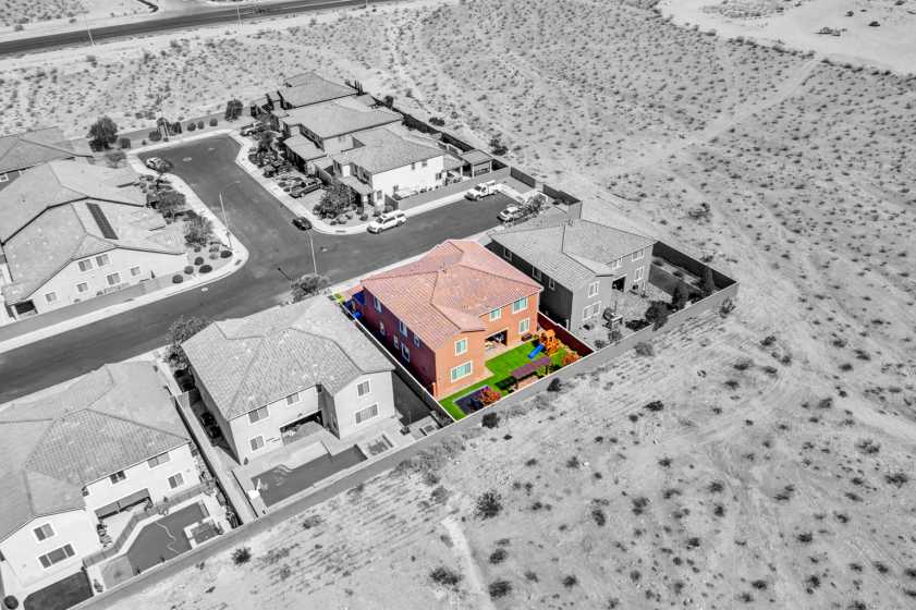Highlighted aerial photo of house Drone photo of highlighted house and everything else is black and white