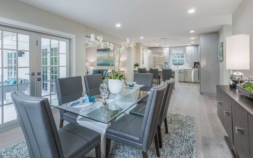 dining room with table set up Dining room with white flower vase on table with table settings
